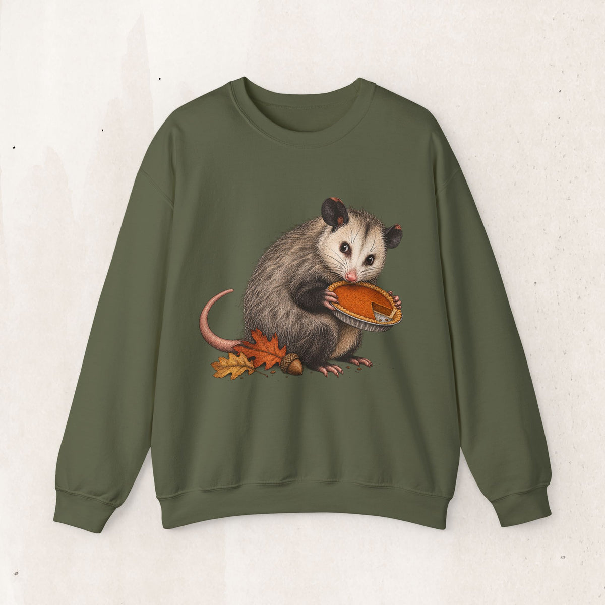 Opossum Thanksgiving sweatshirt with a cute possum hugging an orange pumpkin in autumn leaves