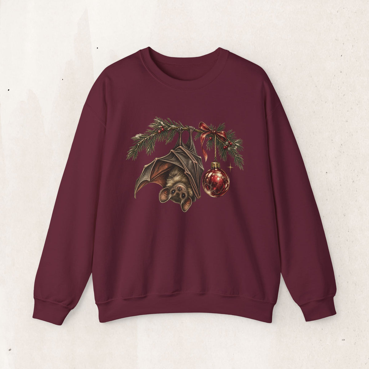 Gothic Christmas bat sweatshirt with a vintage bat, evergreen boughs and a red ornament
