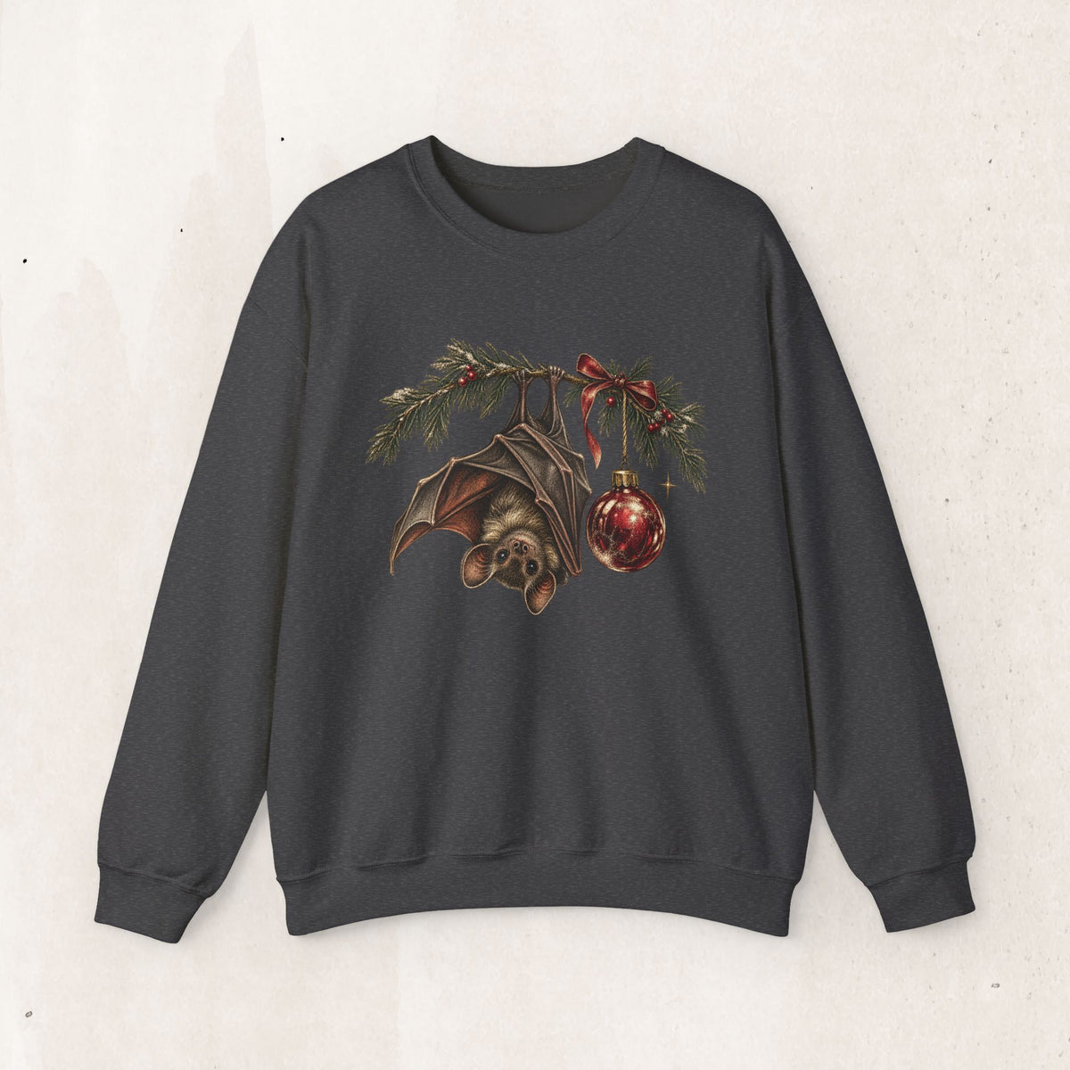 Gothic Christmas bat sweatshirt with a vintage bat, evergreen boughs and a red ornament