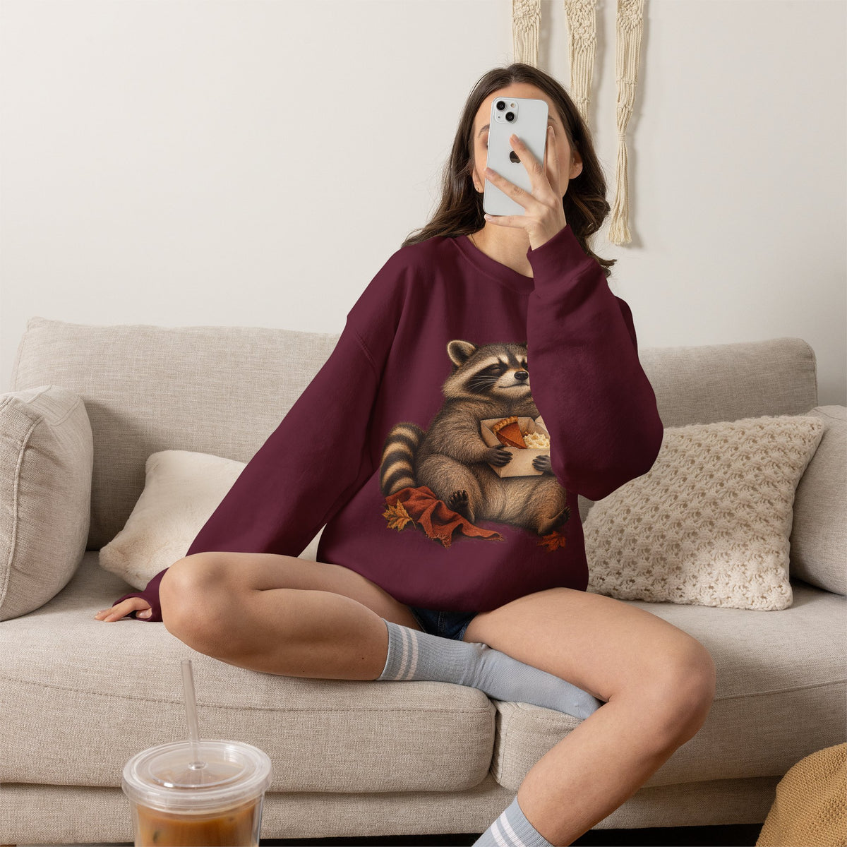 Cute raccoon fall crewneck sweatshirt with a vintage raccoon holding a mug in autumn leaves
