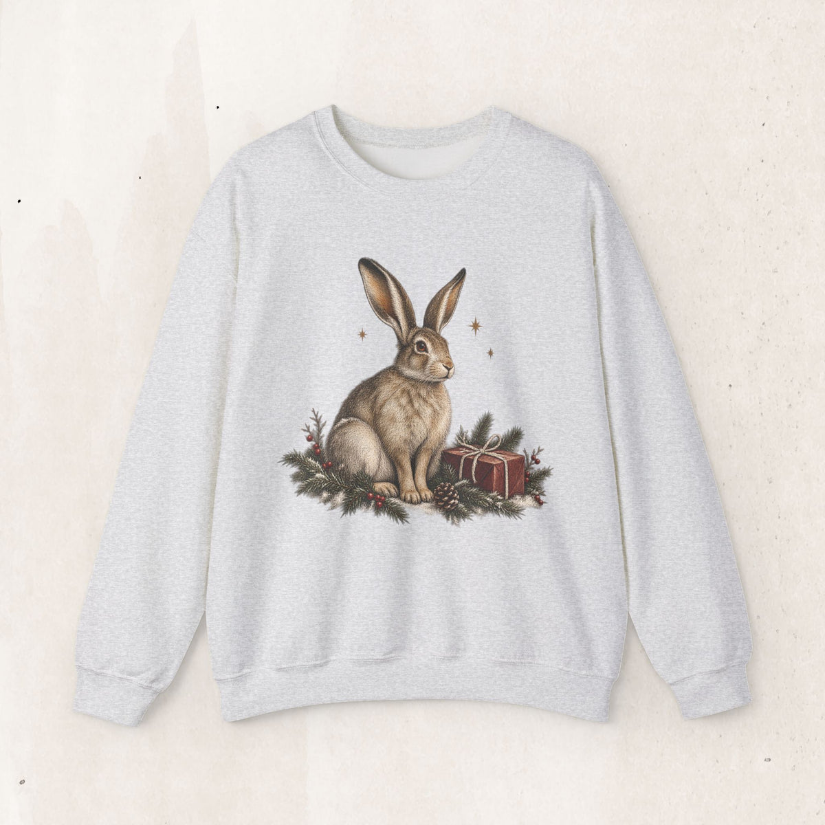 Christmas bunny sweatshirt with a vintage woodland rabbit, evergreen branches, stars and gifts