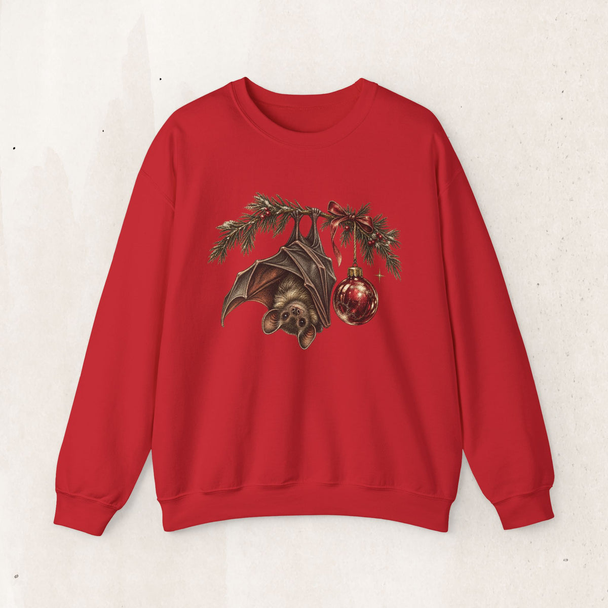Gothic Christmas bat sweatshirt with a vintage bat, evergreen boughs and a red ornament