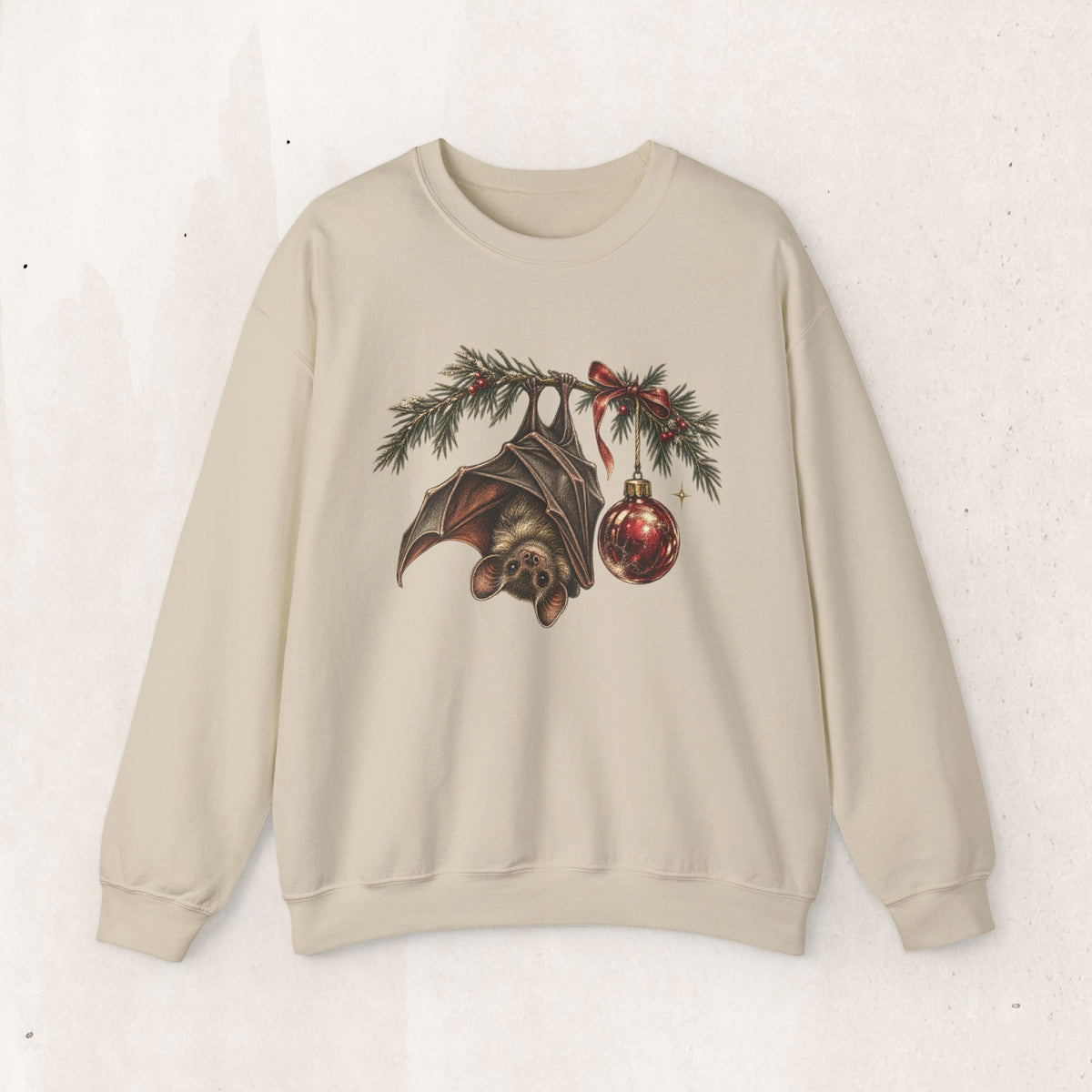 Gothic Christmas bat sweatshirt with a vintage bat, evergreen boughs and a red ornament