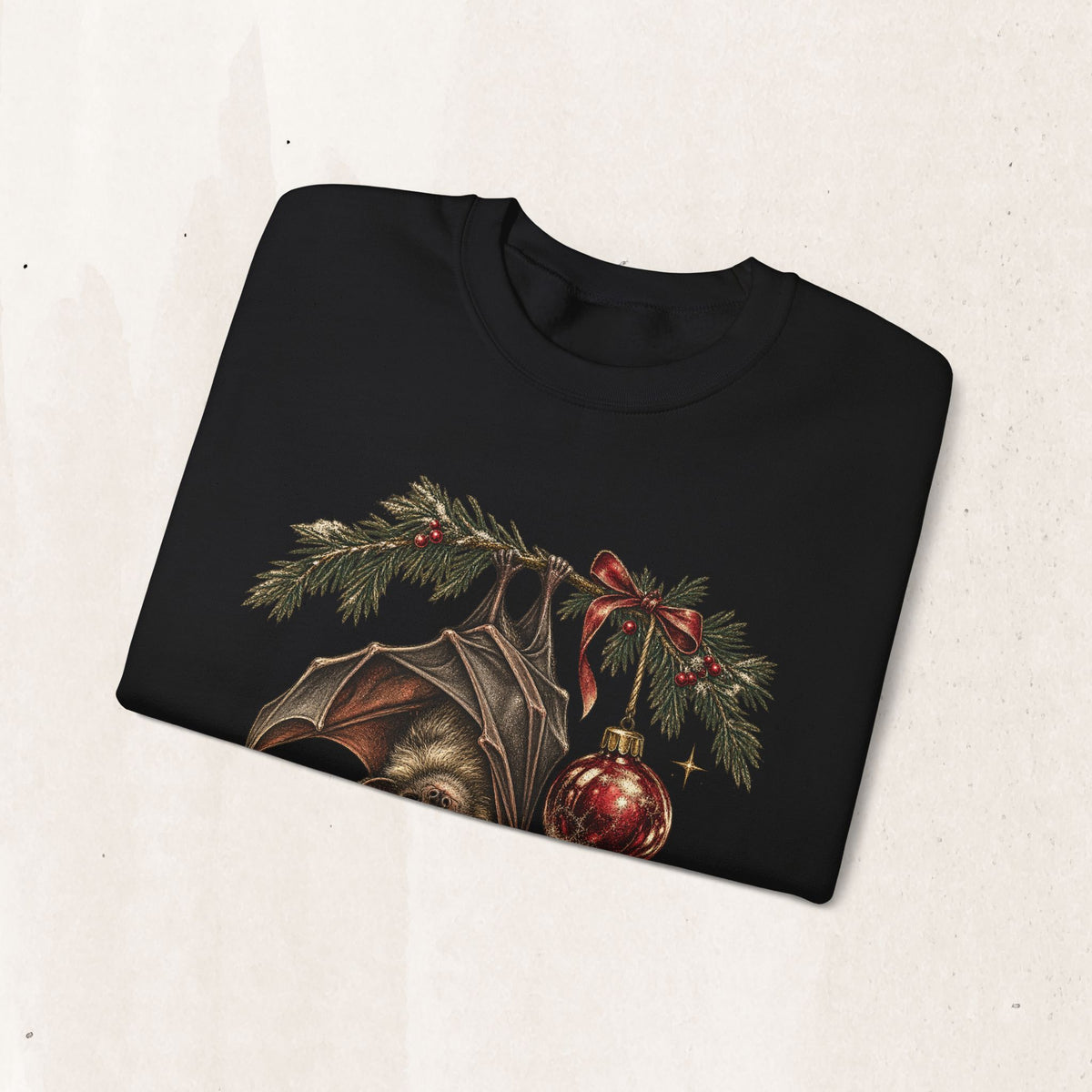 Gothic Christmas bat sweatshirt with a vintage bat, evergreen boughs and a red ornament