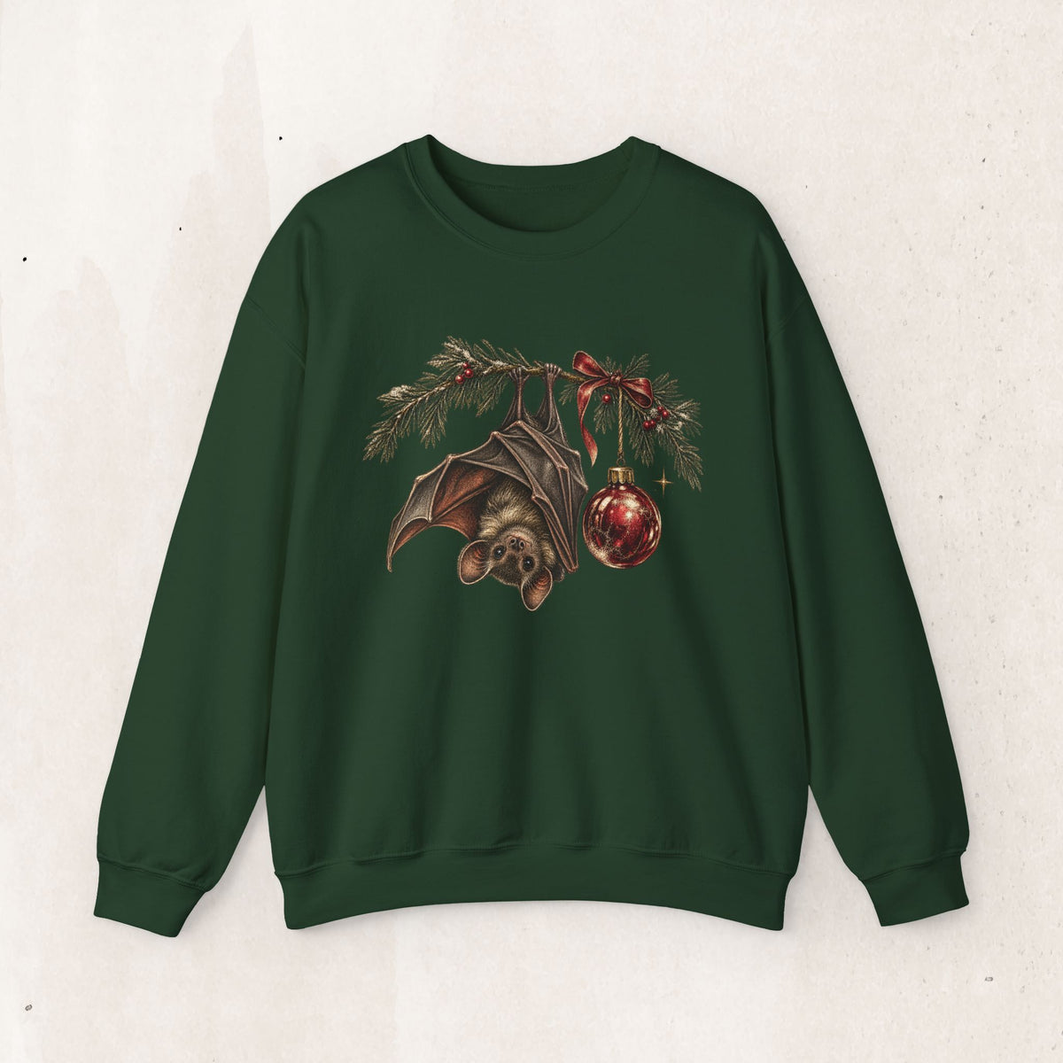 Gothic Christmas bat sweatshirt with a vintage bat, evergreen boughs and a red ornament