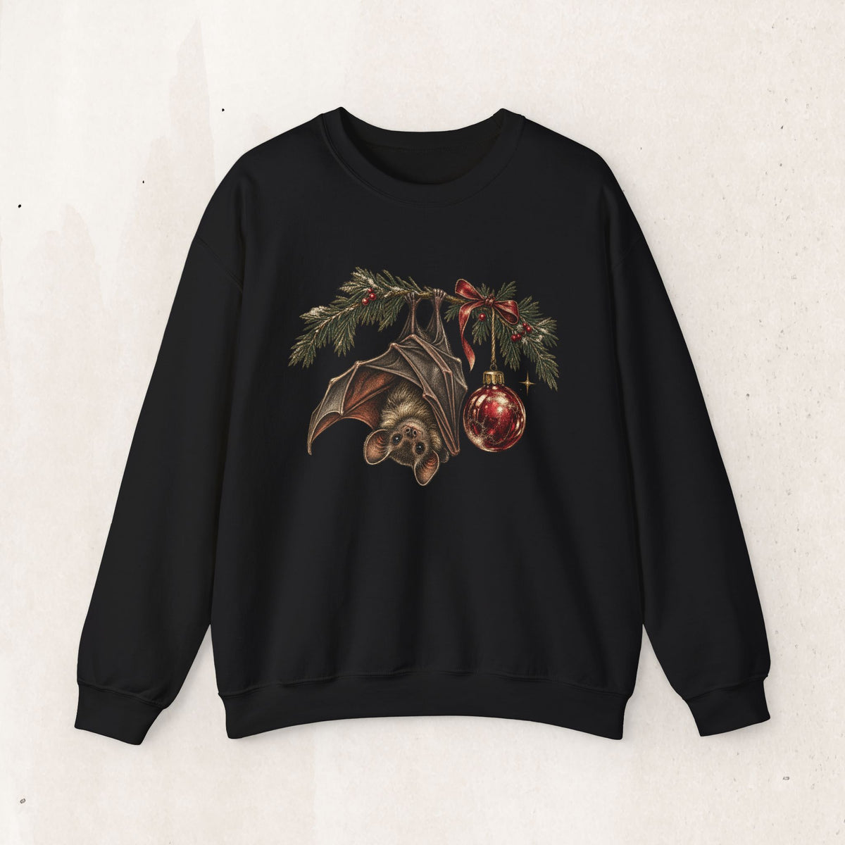 Gothic Christmas bat sweatshirt with a vintage bat, evergreen boughs and a red ornament