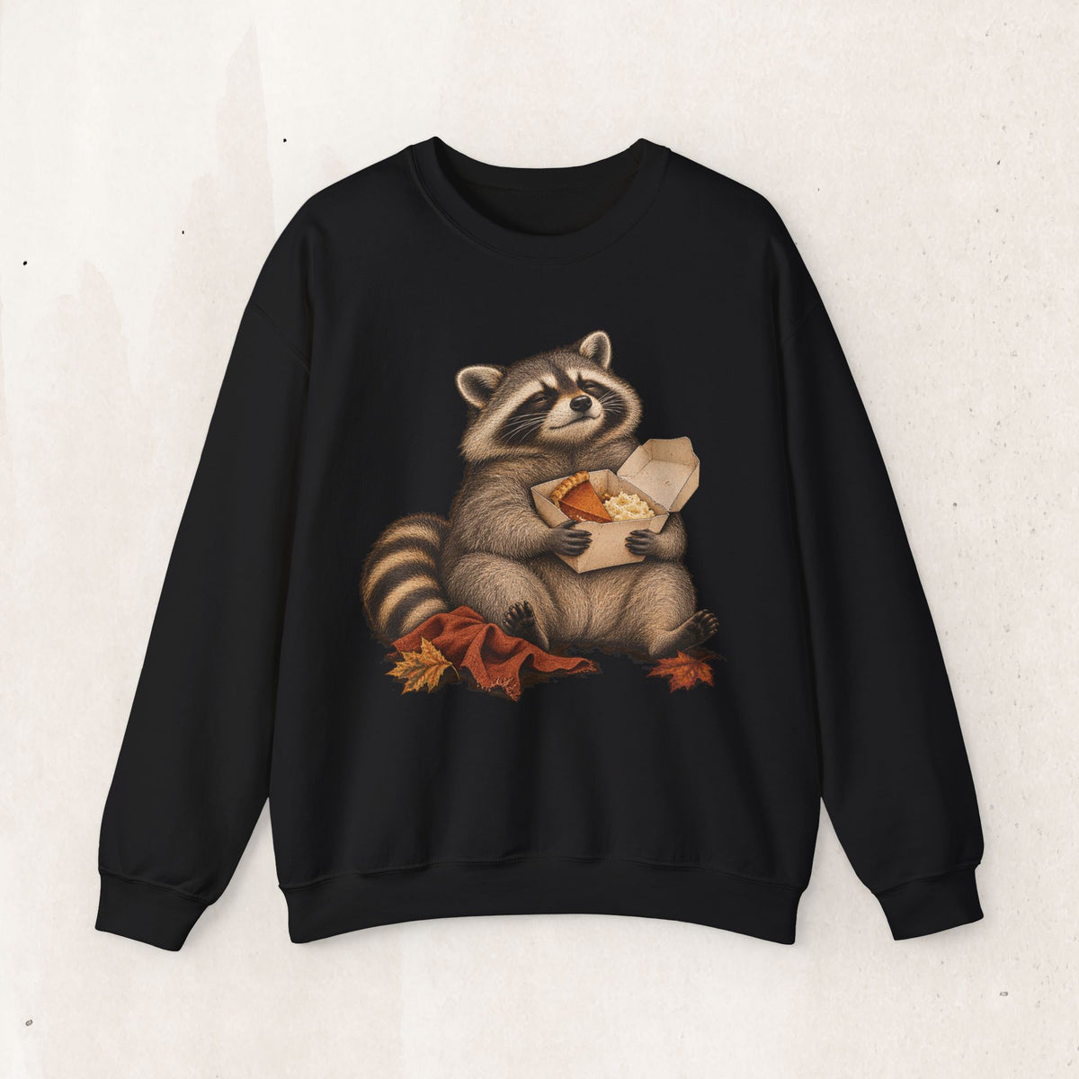 Cute raccoon fall crewneck sweatshirt with a vintage raccoon holding a mug in autumn leaves