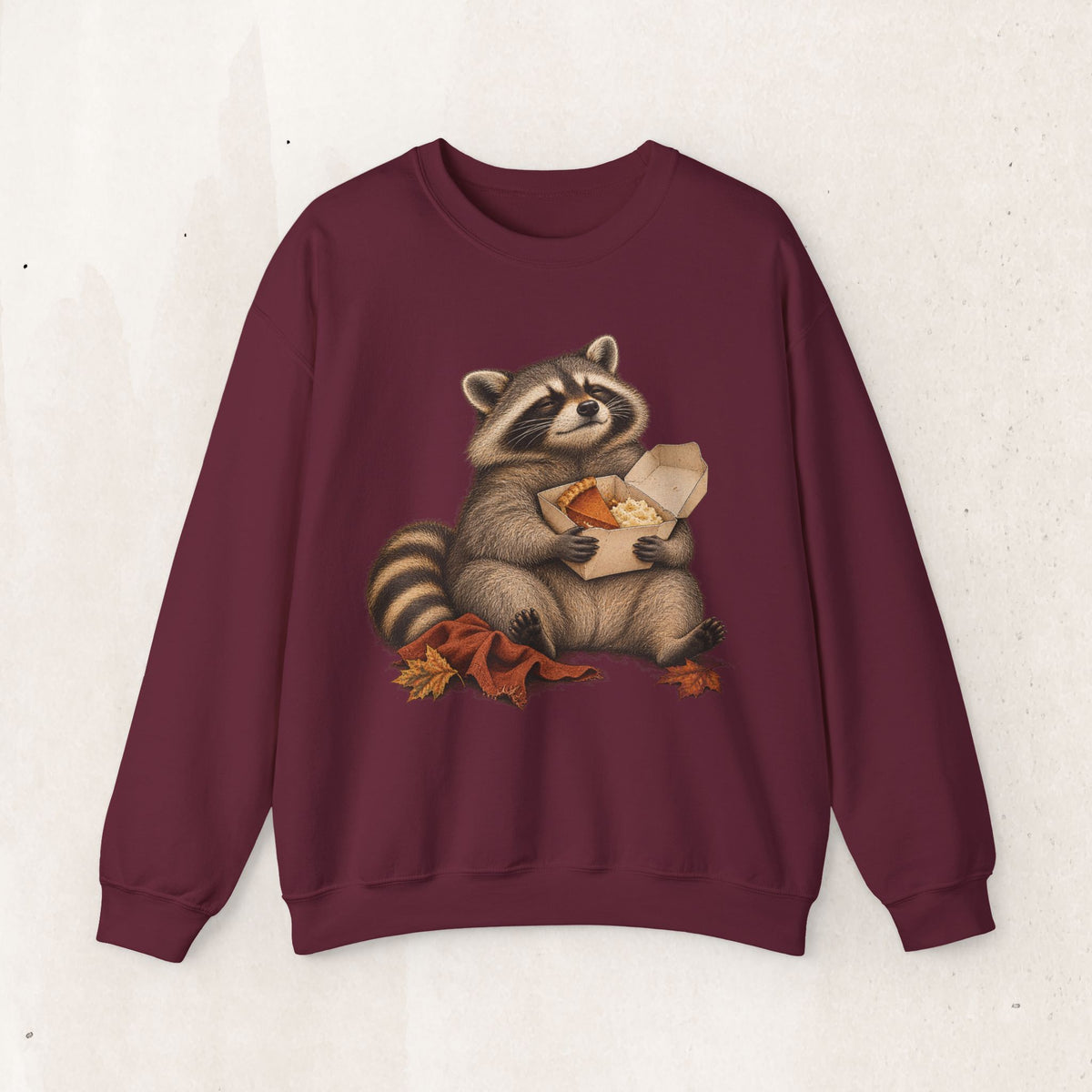 Cute raccoon fall crewneck sweatshirt with a vintage raccoon holding a mug in autumn leaves