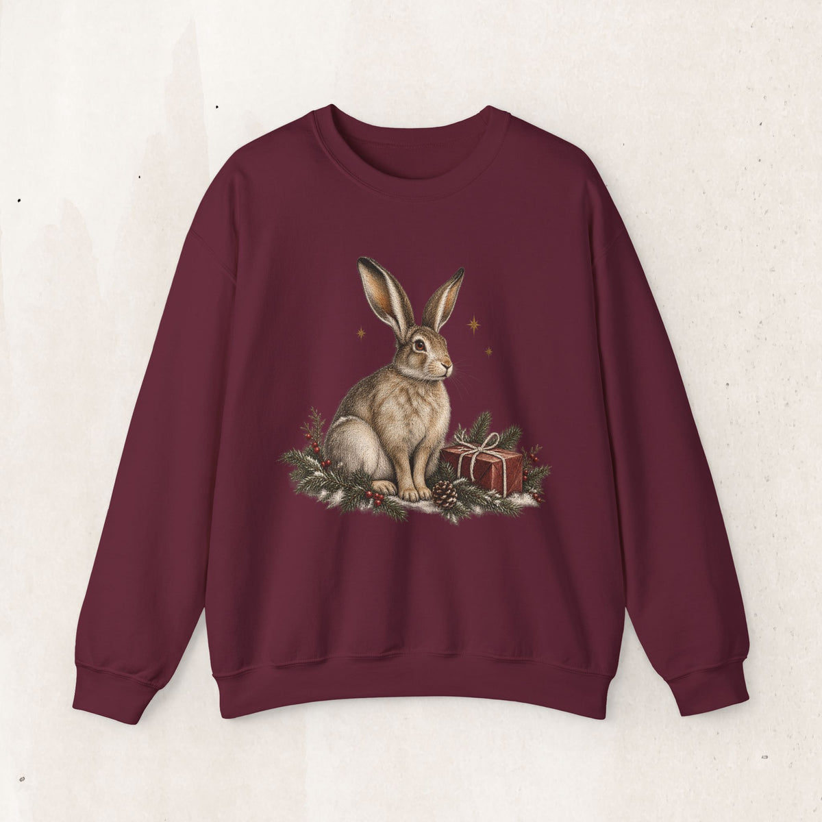 Christmas bunny sweatshirt with a vintage woodland rabbit, evergreen branches, stars and gifts