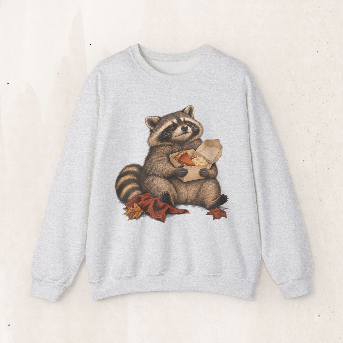 Cute raccoon fall crewneck sweatshirt with a vintage raccoon holding a mug in autumn leaves