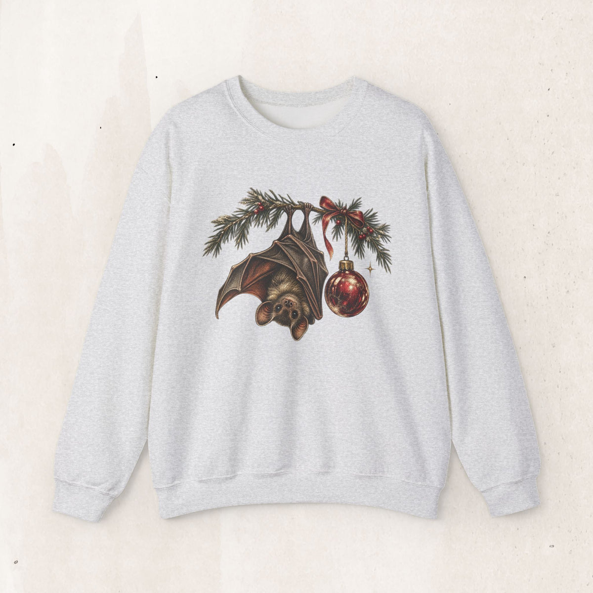 Gothic Christmas bat sweatshirt with a vintage bat, evergreen boughs and a red ornament