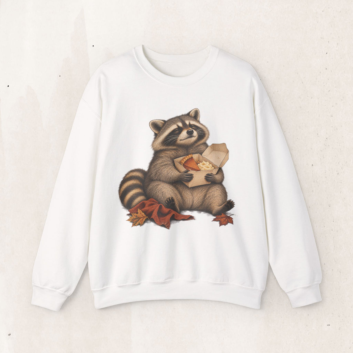 Cute raccoon fall crewneck sweatshirt with a vintage raccoon holding a mug in autumn leaves