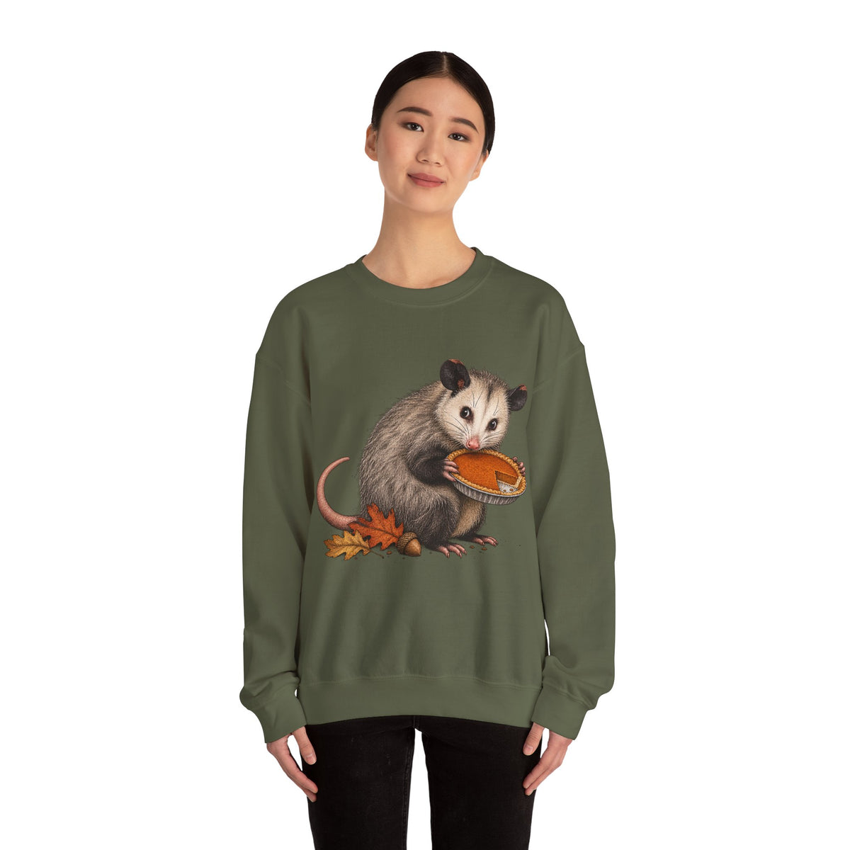 Opossum Thanksgiving sweatshirt with a cute possum hugging an orange pumpkin in autumn leaves