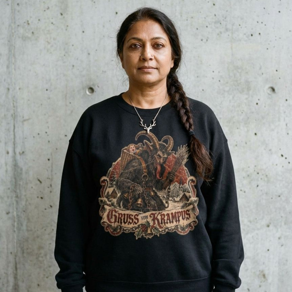 Model wearing the Gruss Vom Krampus Christmas Sweatshirt against a cement wall