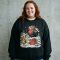 Model wearing Christmas Santa Bear Sweatshirt against a cement wall