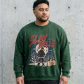 Model wearing Slay Bells Christmas Sweatshirt against a cement wall