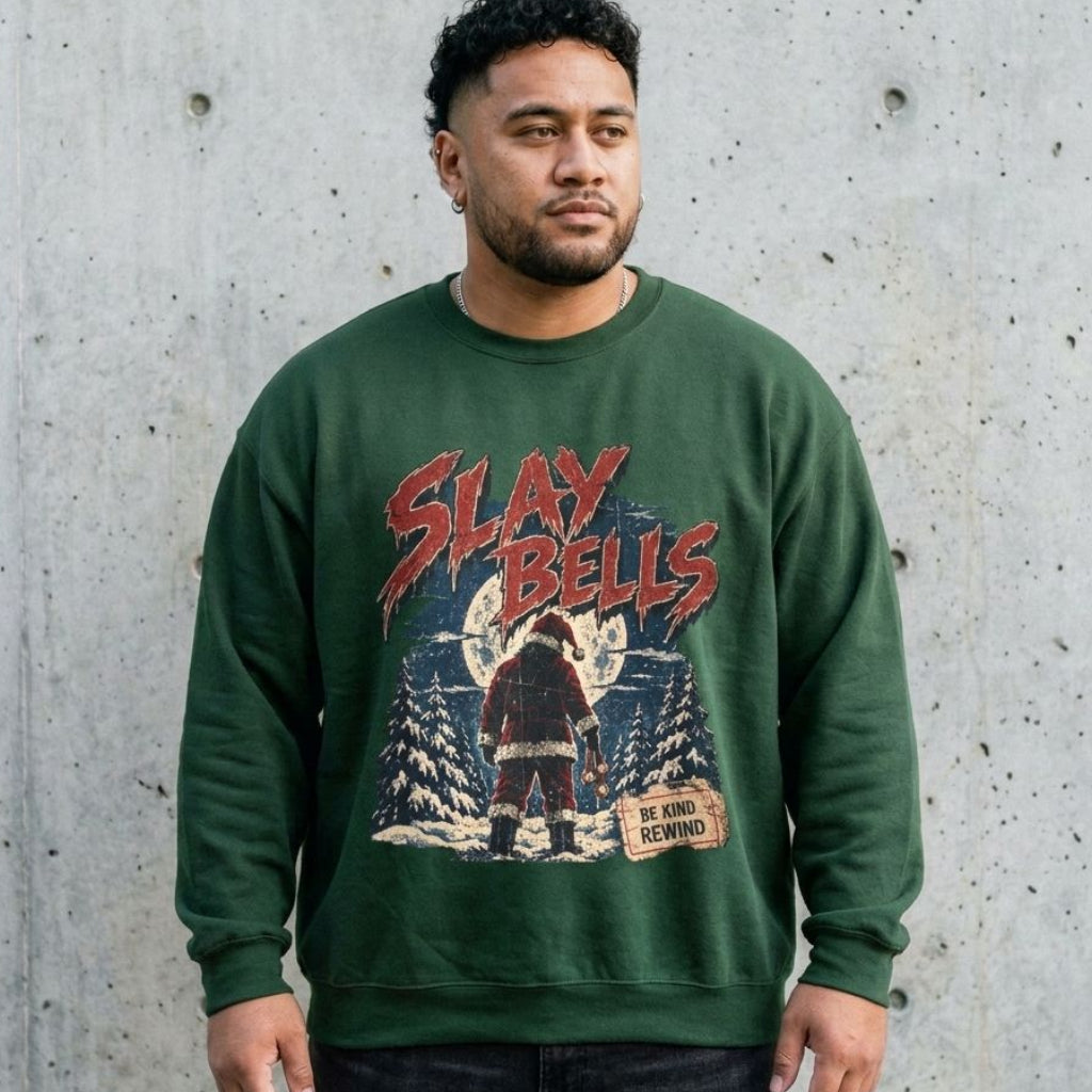 Model wearing Slay Bells Christmas Sweatshirt against a cement wall