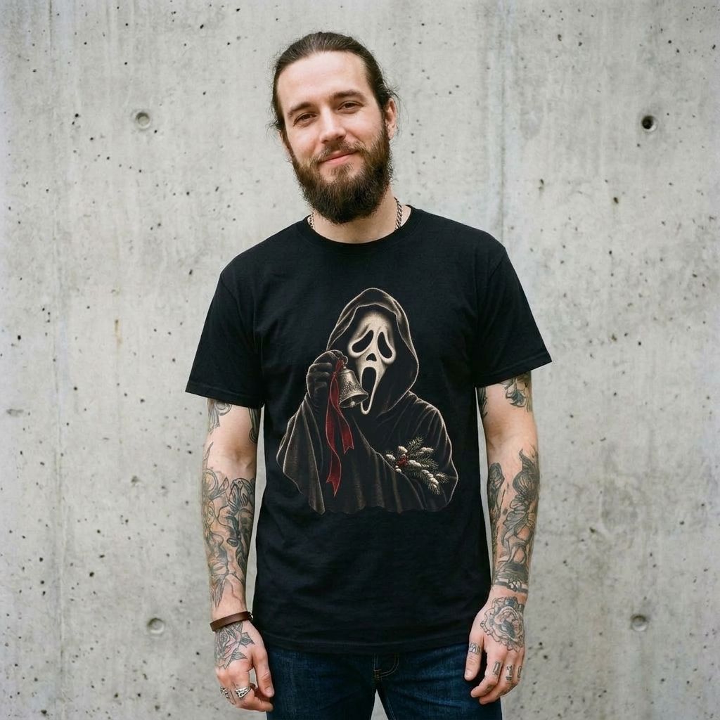 Model wearing Ghostface Christmas Tee against a cement wall