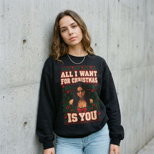 Model wearing All I Want for Christmas Is You 'Obsession' Sweatshirt against a cement wall
