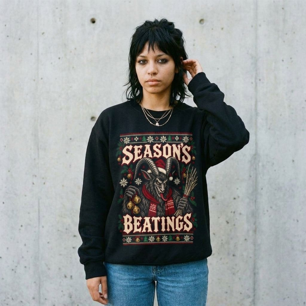 Model wearing Seasons Beatings Krampus Ugly Christmas Sweatshirt against a cement wall