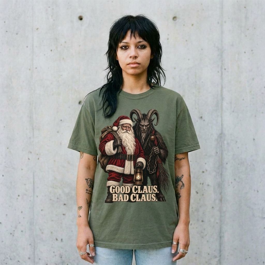 Model wearing Santa & Krampus Christmas Graphic Tee against a cement wall