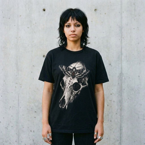 Model wearing Animal Skull Graphic Tee against a cement wall