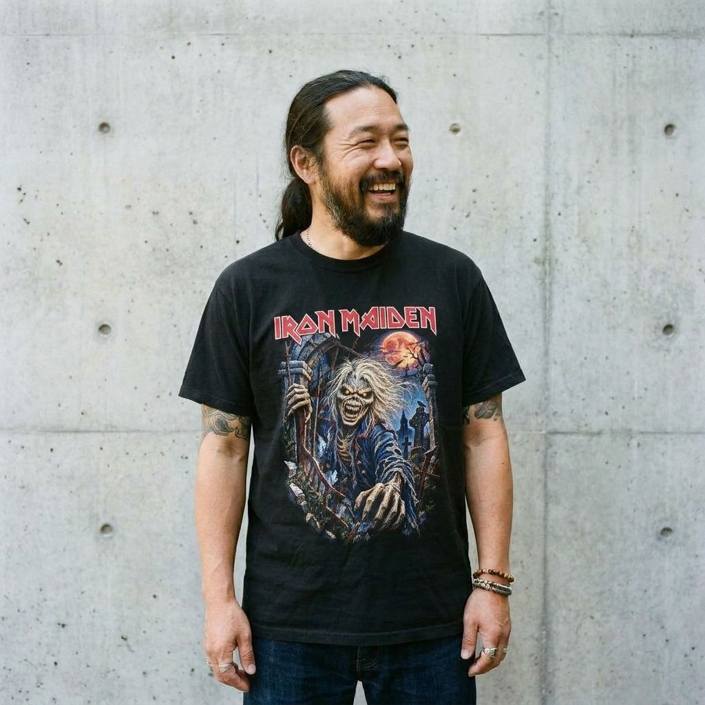 Model wearing Iron Maiden Graphic Tee – Vintage Heavy Metal Shirt against a cement wall