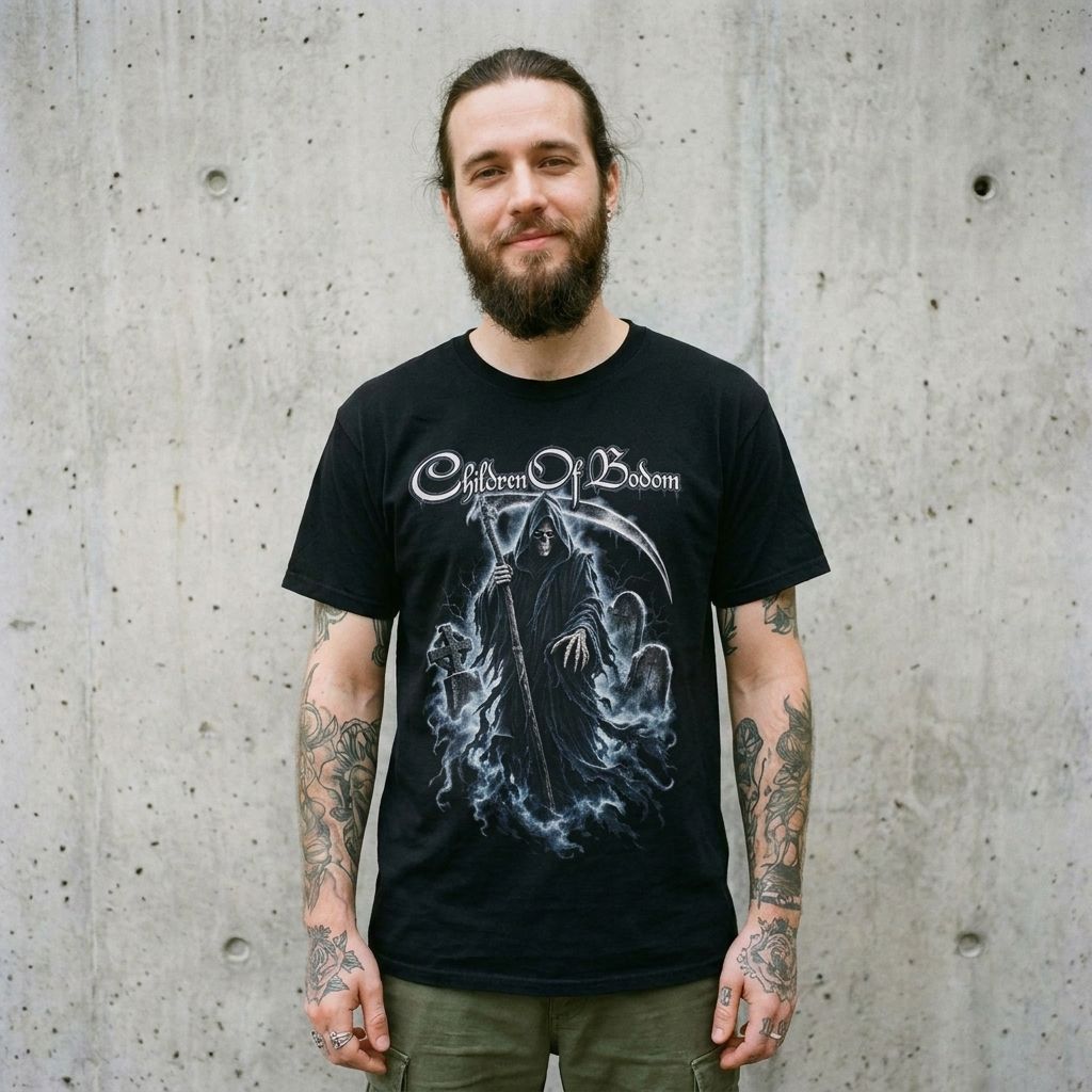 Model wearing Bodom Graphic Tee – Gothic Reaper Metal Shirt against a cement wall