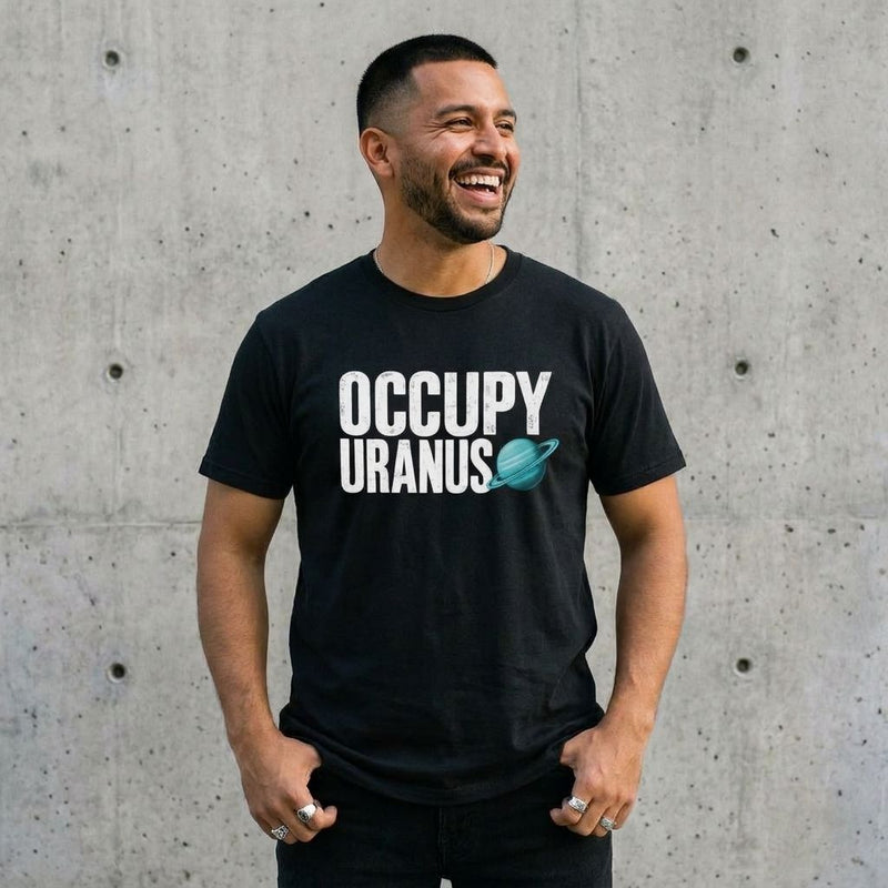 Model wearing Occupy Uranus Graphic Tee against a cement wall