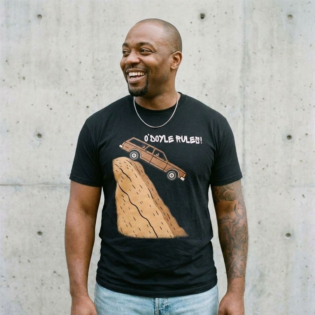 Model wearing Billy Madison "O'Doyle Rules!" Graphic Tee against a cement wall