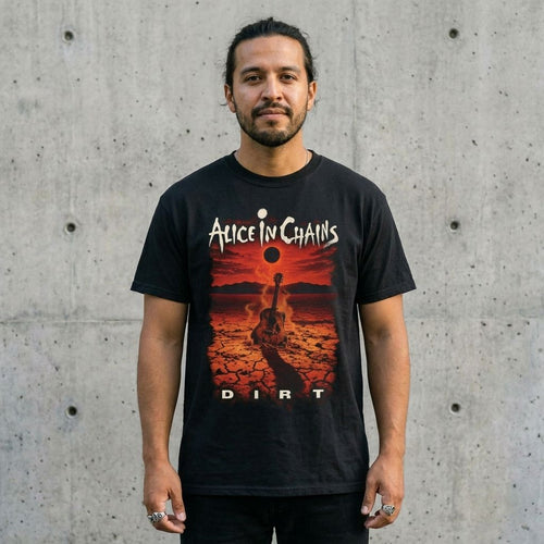 Model wearing Alice in Chains “Dirt” Album Tee against a cement wall