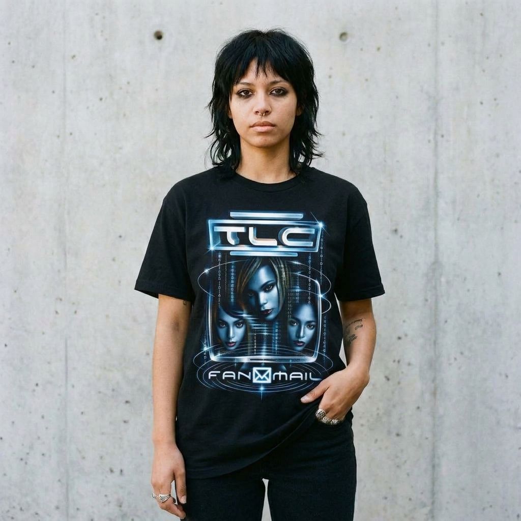 Model wearing TLC Fan Mail Graphic Tee against a cement wall