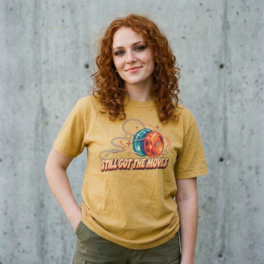 Model wearing Yo-Yo 'Still Got The Moves' Tee against a cement wall