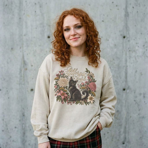 Model wearing Allergic to People Cat Sweatshirt against a cement wall