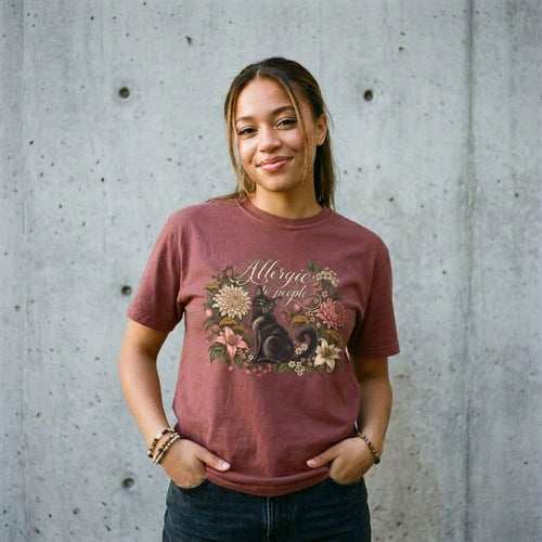 Model wearing Allergic to Mornings Cat Tee against a cement wall