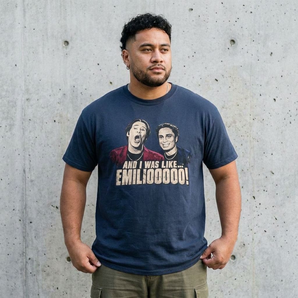 Model wearing Night At The Roxbury 'And I Was Like... EMILOOOOO!' Tee against a cement wall