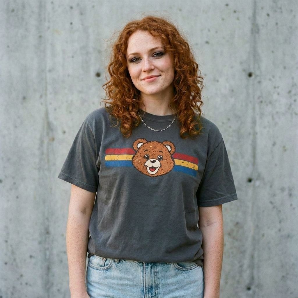 Model wearing Teddy Ruxpin Retro Tee against a cement wall