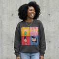 Model wearing Retro Cartoon Character Collage Sweatshirt, Nostalgic Cartoon Crewneck, Colorful Retro Graphic Sweater, Cartoon Lover Gift against a cement wall