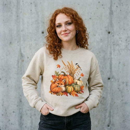 Model wearing Autumn Harvest Pumpkin Fox Sweatshirt against a cement wall