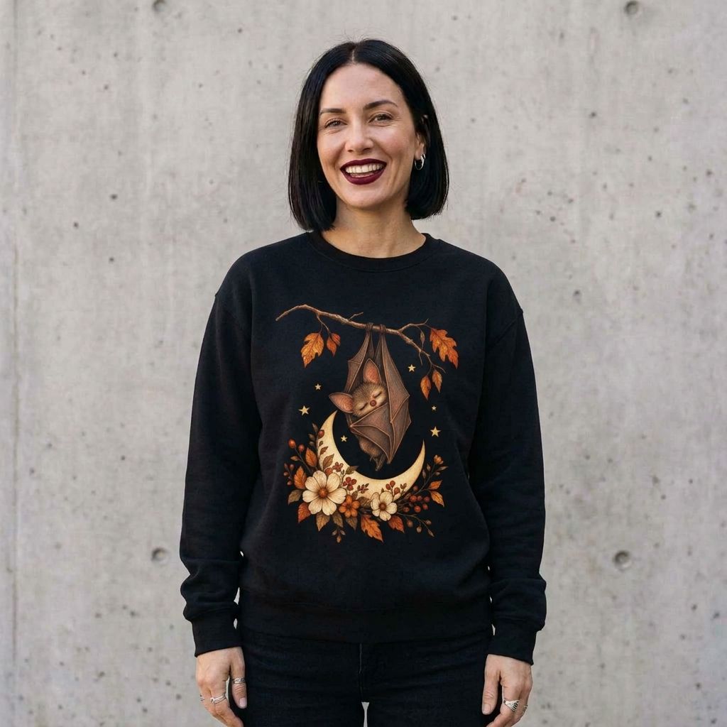 Model wearing Autumn Bat Moon Sweatshirt against a cement wall