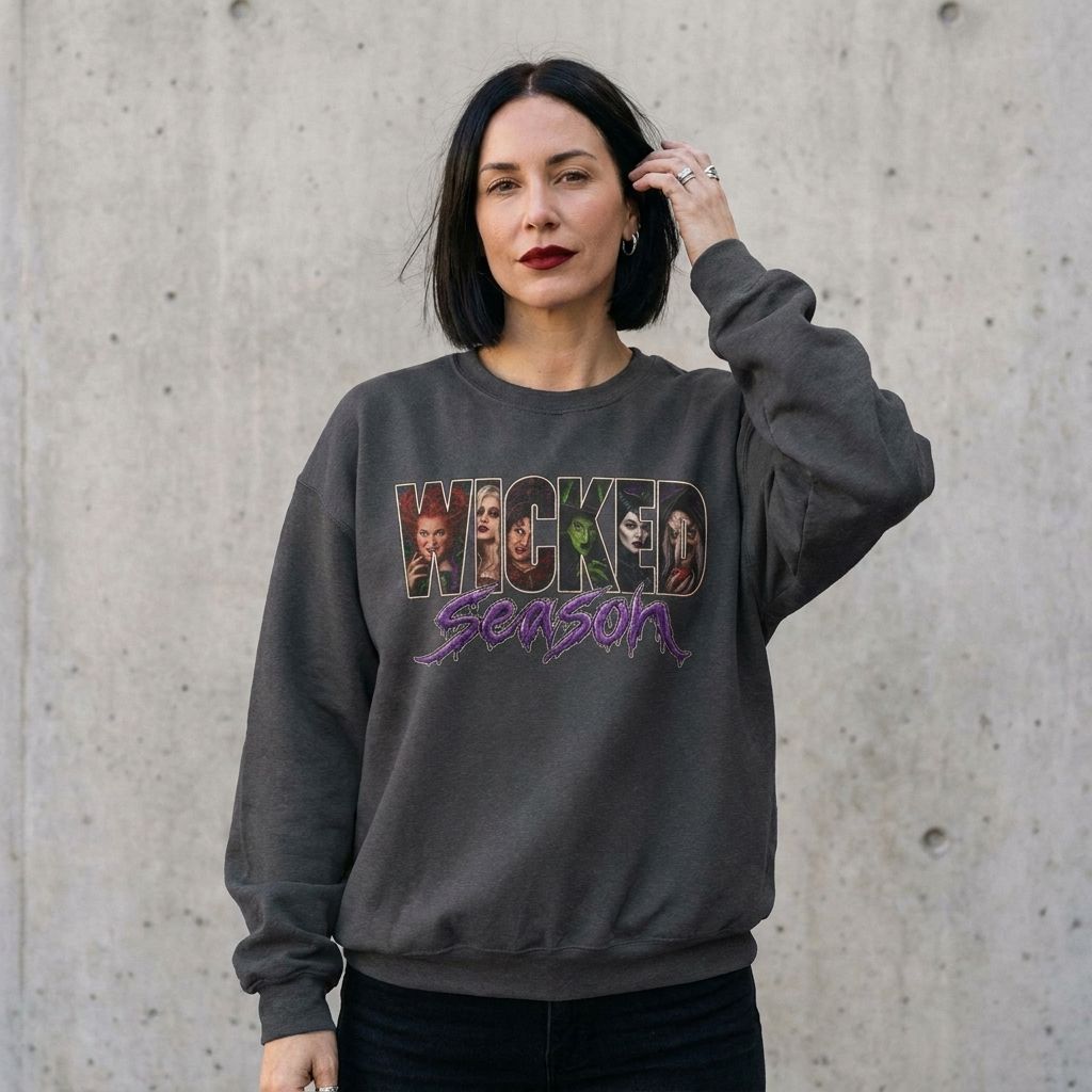 Model wearing Wicked Season Sweatshirt against a cement wall