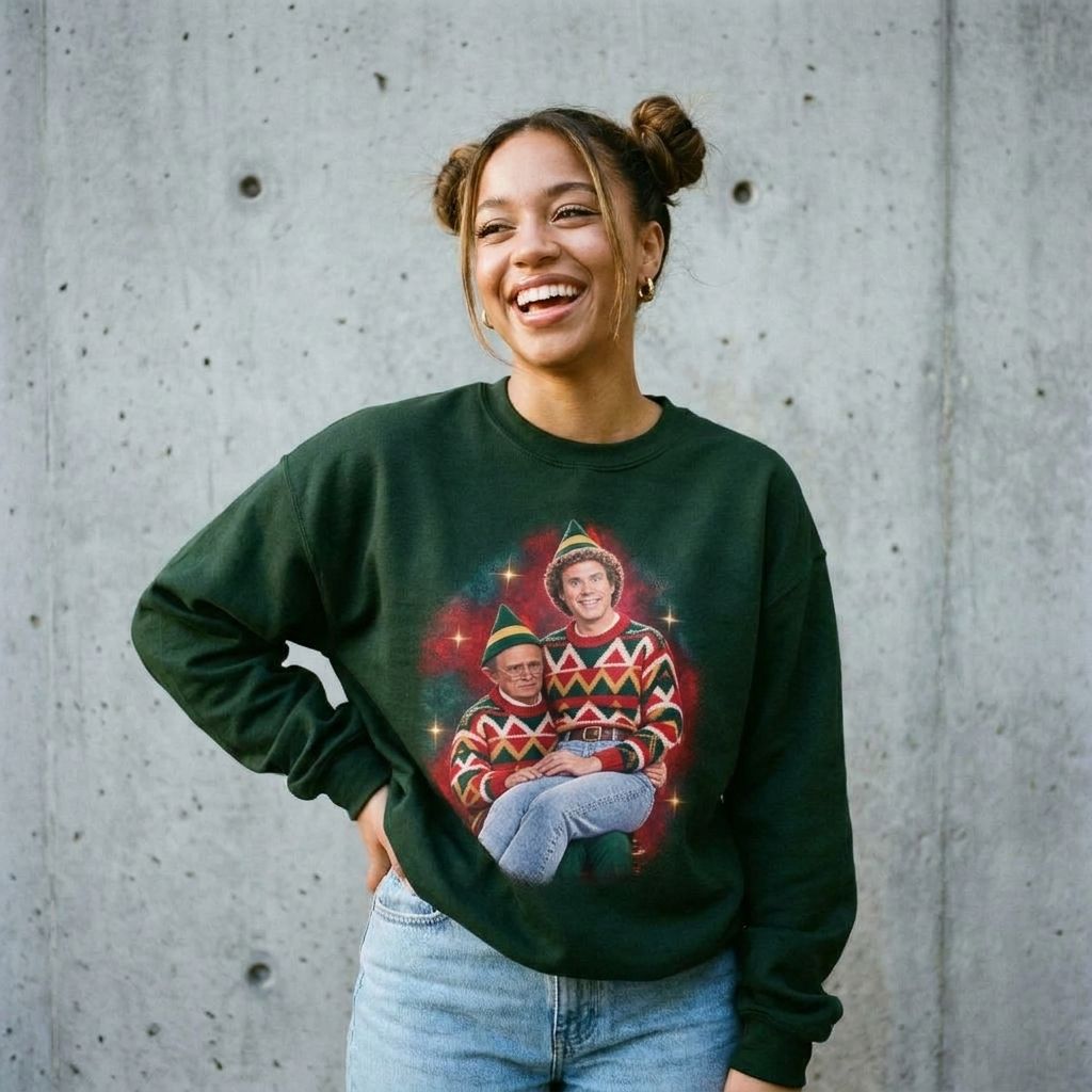 Woman wearing the Buddy the Elf 80s glamour portrait Christmas sweatshirt against a cement wall