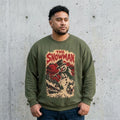 Man wearing The Snowman horror movie poster Christmas sweatshirt against a cement wall