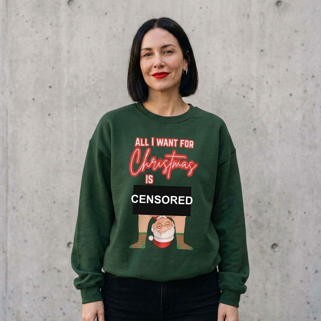 Woman wearing the All I Want for Christmas Mrs. Claus couples sweatshirt against a cement wall