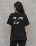 Model wearing the black Please Stay; suicide awareness t-shirt, back view