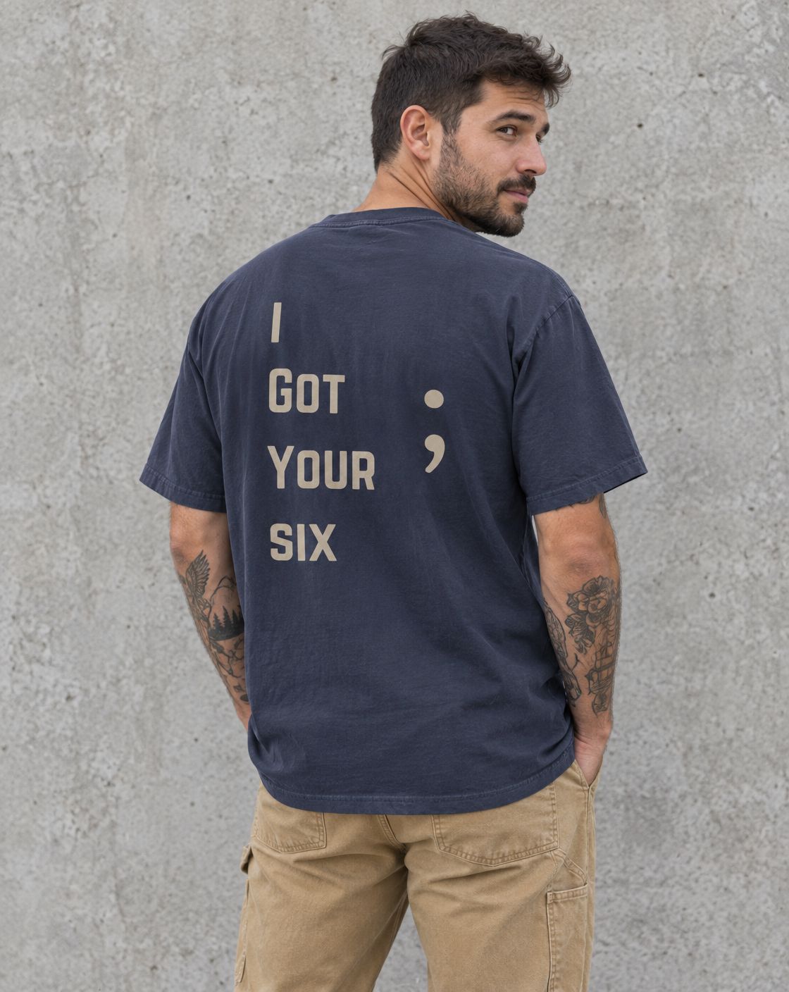 Model wearing the navy I Got Your Six veteran suicide awareness t-shirt, back view