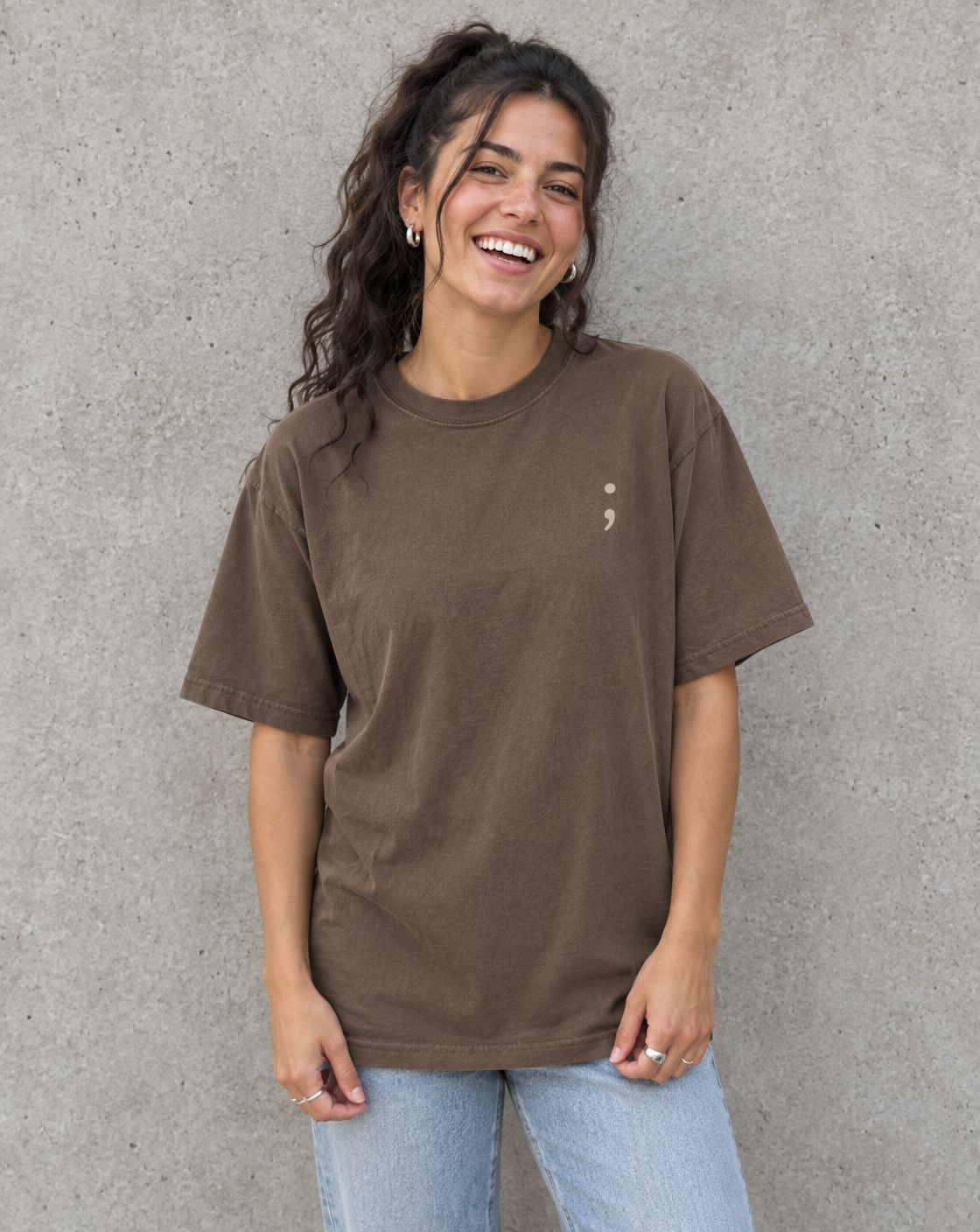 Model wearing the espresso You Matter. t-shirt, front view with small semicolon