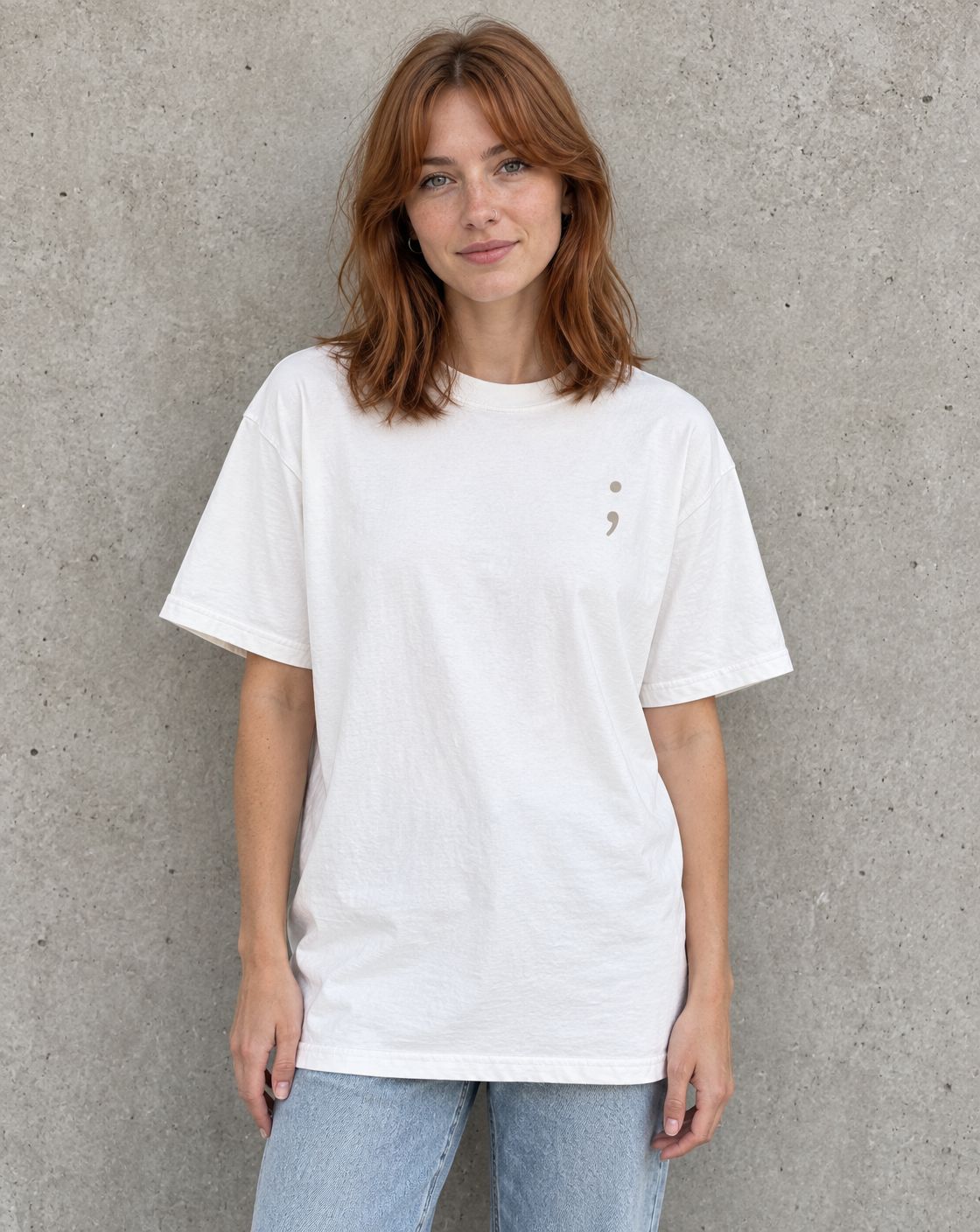 Model wearing the white To the Person Behind Me, You Matter t-shirt, front view with small semicolon