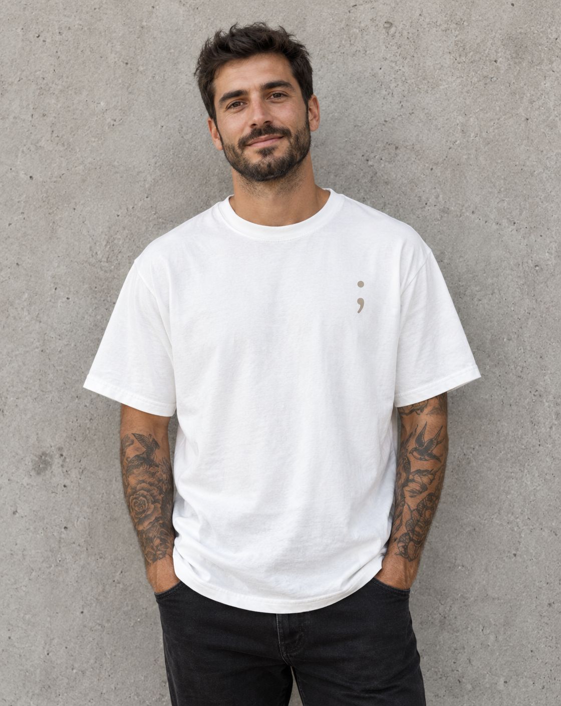 Model wearing the white Keep Going t-shirt, front view with small semicolon
