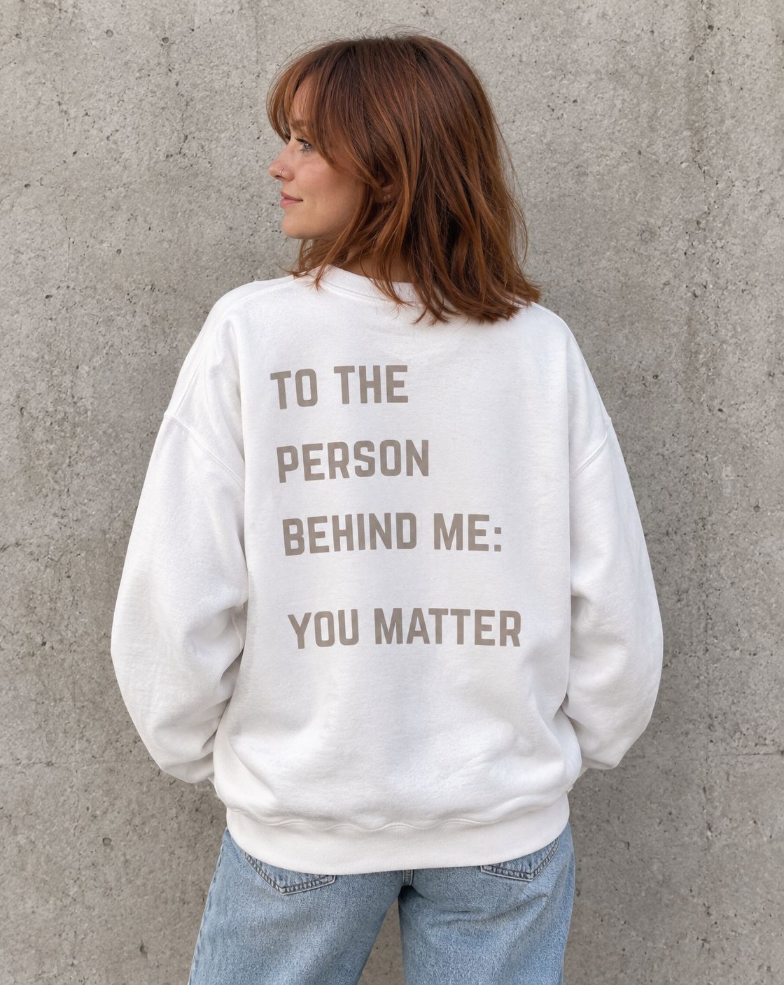 Model wearing the white To the Person Behind Me, You Matter suicide awareness crewneck sweatshirt, back view